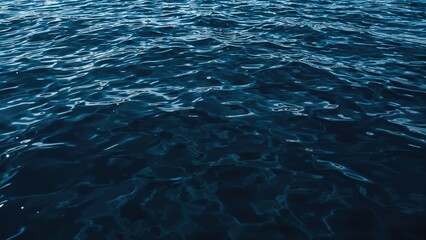 Obraz premium Top view of calm sea surface with gentle blue waves