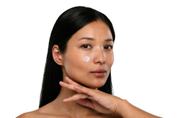 Woman Applying Moisturizing Cream on Her Face with Gentle Care