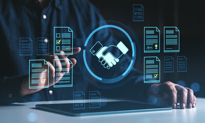 Digital contract agreement concept with handshake icon and electronic documents displayed on...