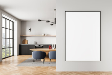 Modern kitchen interior with large empty poster on clean wall for design mockup or art display...