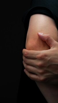 sprain or fracture of arm in adult muscular man in black t-shirt.
Male arm with arthritis or bruise symptoms.
Patient's arm pain due to muscle strain