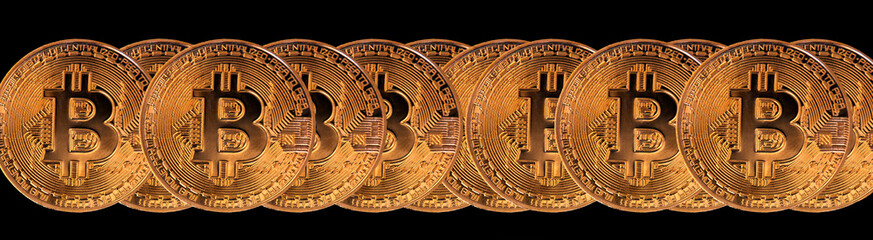 many coins of bitcoin in a row, isolated on black background