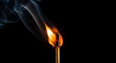 A lit matchstick with swirling smoke against a stark black background.