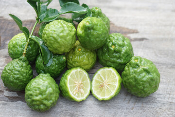 Fresh kaffir limes fruits.  Aromatic Thai herb is used for cooking with sour taste, natural shampoo and homemade cleaners. Known for its citrusy fragrance and traditional medicinal properties.   