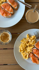 Savory brunch scene with silky smoked salmon and scrambled eggs, ideal for International Breakfast Day or Hygge celebration
