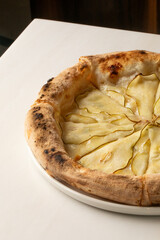 Golden-crusted pear pizza whispers culinary alchemy, celebrating a fusion feast for National Cheese Pizza Day and Pi Day