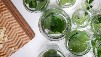 Herbal infusion jars dance beside garlic slices, whispering secrets of culinary rituals and pan-European Midsummer Eve celebrations
