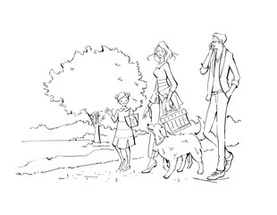 Family walking with their dog in the park