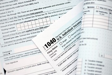 Obraz premium 1040 US individual income tax return form blank close up. Few pages of united states tax blank