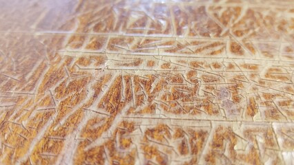 surface of the lid of an old Soviet brown desk