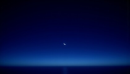 A solitary crescent moon shines in the deep, tranquil expanse of a gradient blue sky.