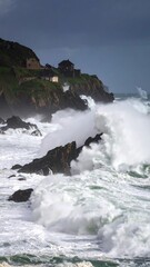 Stormy seas crash against rocky coast