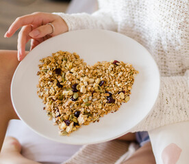 Muesli in a bowl in heart shape