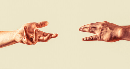 Two male hands reaching towards each other on isolated white background. Man gives his hand to a woman. Two hands, helping arm of a friend, teamwork. Rescue, helping gesture or hands