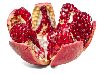 A cut pomegranate with visible seeds full of juice inside, a sweet, ripe tropical fruit