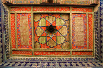 Painted and decorated wooden ceiling inside the Khan’s harem residence in Khiva, Uzbekistan