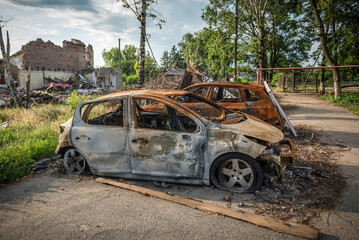 Burnt damaged car of a civilian during the war, Russian attack against Ukraine. War crimes of...