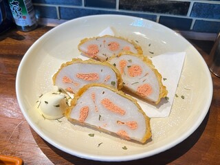 Tempura-style lotus root filled with spicy mentaiko roe, offering a crunchy bite with a savory kick.