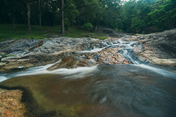 Fototapeta premium Huai Kaew Waterfall in Chiang Mai Surrounded by Lush Greenery