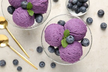 Tasty sorbet with blueberries and mint on light grey table, flat lay