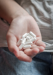 Teenager girl, youth child kid having overdose drug medicine tablets, taking medical pills for pain...