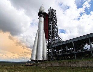 A space shuttle on a launch pad against a blue sky, ready for a mission