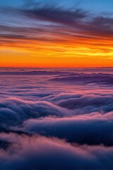 Obraz premium Breathtaking Sunrise Over a Sea of Clouds with Mountain Ridges in the Distance
