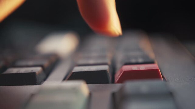 Decision-Making: Close-up of a Finger Pressing a Red Keyboard Button