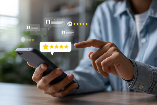 Hand of woman using smartphone with five star for evaluate product and service.