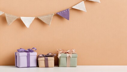 Festive gifts and decorations against a light peach wall.
