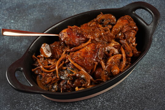 Deep fried chicken with mushrooms ,onions and  date syrup.