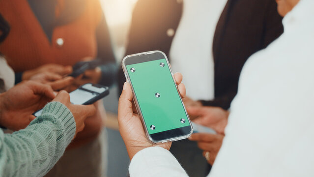 Green screen, hands and phone with business people in circle at work for communication or networking. Huddle, information transfer and mobile with employee team in office together for connectivity - Powered by Adobe