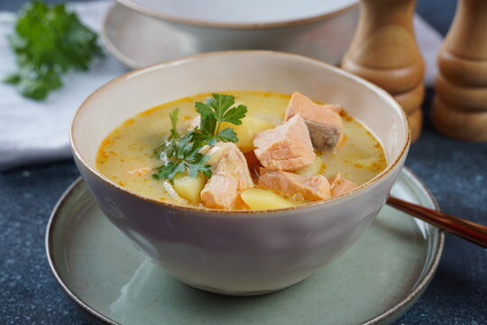 Fish soup in a bowl.Creamy fish soup with salmon, potatoes, onions , carrots, dill and celery. Kalakeitto- traditional dish of the Finnish cuisine or Russian Ukha Fish Head Soup. Healthy Food Concept.
