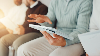 Fototapeta premium Hands, business and person with tablet in waiting room for job interview, sign up and company website. Candidates, row and digital for research, online application and reading feedback of recruitment