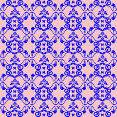 Lotus Emblem Floral Pattern – Blue and Pink.A royal-looking symmetrical pattern of stylized lotus-like emblems in blue on a soft pink canvas, repeating in formal layout.