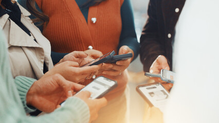 Hands, phone and sharing with business people in circle at work for communication or networking. Huddle, information transfer and team with employee group in office together for mobile connectivity