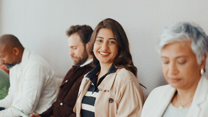 Woman, portrait and happy in queue for interview with pride, confident and ready at recruitment...