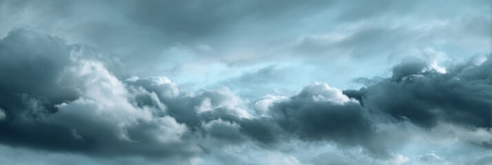 Obraz premium Dramatic Sky with Dark Clouds and Light Blue Atmosphere Background