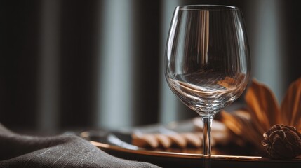 Elegant clear wine glass on a stylish setting with decor elements