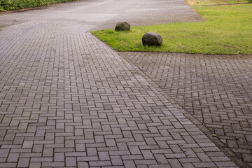 Interlocking pavers creating a pathway and parking area
