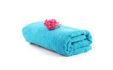 One rolled blue towel and flower isolated on white