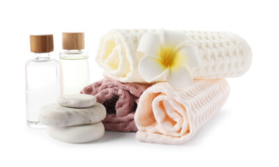 Spa composition with waffle towels and cosmetic products isolated on white