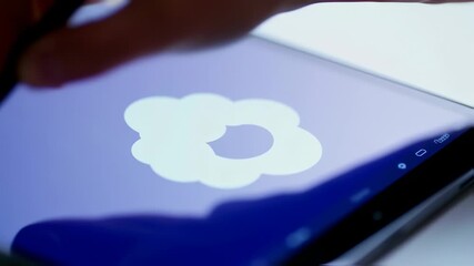 Digital artist creating innovative cloud icon with stylus on tablet display device - Powered by Adobe