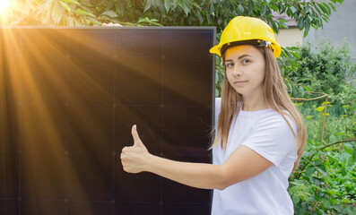 Woman with solar panels. Energy independence, sustainable development. Green energy concept