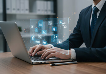 Businessman typing on laptop with an intricate data flow and business process diagram. Represents digital transformation, IT solutions, and data management.