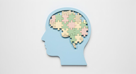 Human head silhouette filled with colorful puzzle pieces. Represents mental health, understanding, intelligence, and cognitive processes.