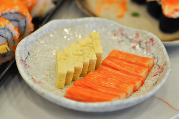 Japanese omelete, japanese omelette or  sweet egg or sweetened egg or tamagoyaki or  Japanese rolled omelette and imitation crab or crab stick