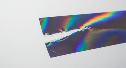 Torn Holographic Tape Texture on White Background


