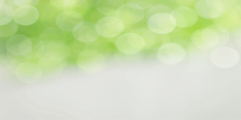 Obraz premium Green abstract bokeh background with soft bright light and blurred nature-inspired design pattern
