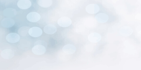 Fototapeta premium Abstract blue bokeh background with bright glowing lights and soft winter holiday sparkle pattern